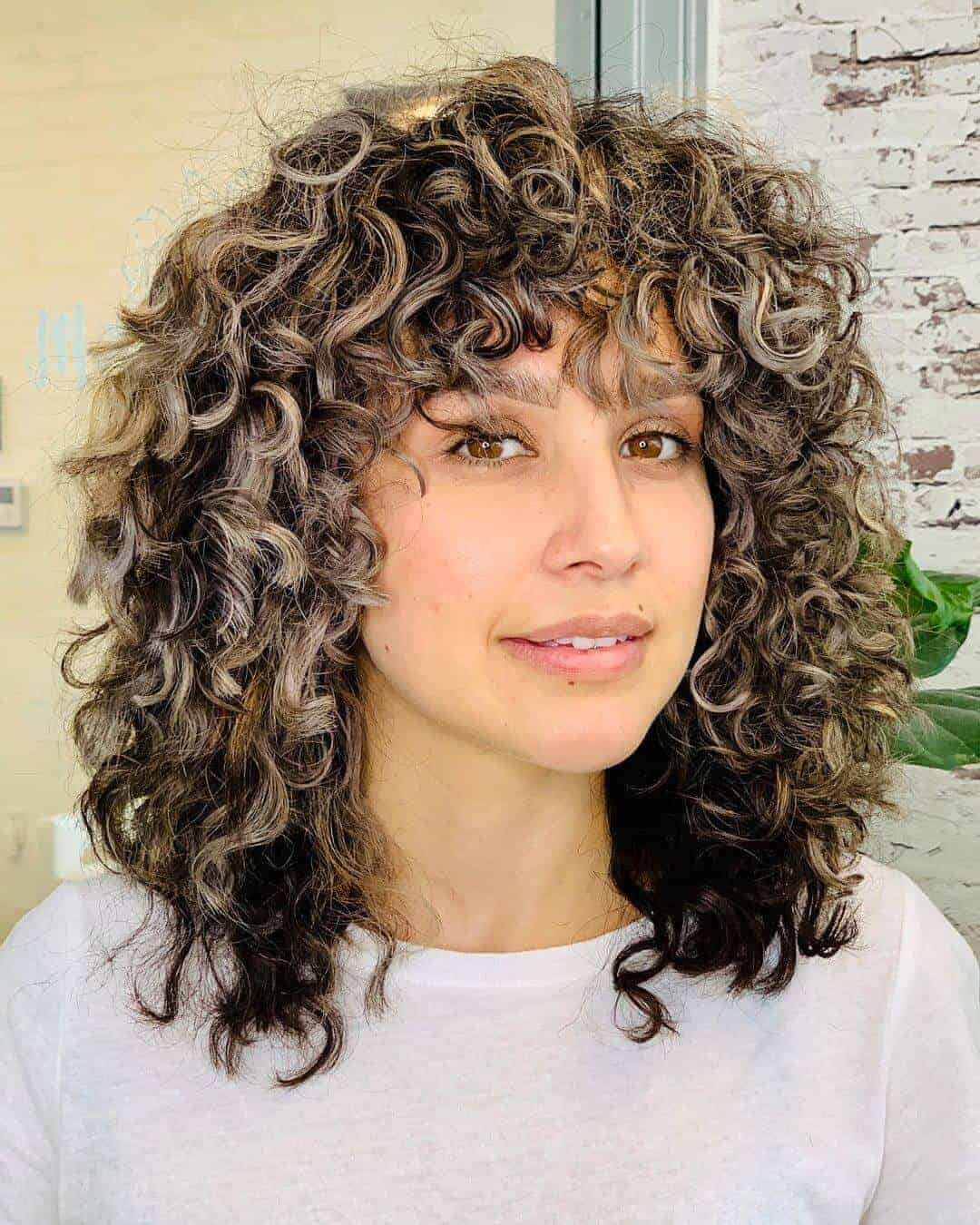 Curly layer with bangs by urbanbloomcurls
